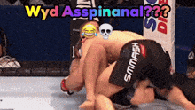 two men are wrestling in a ring with the words wyd asspinanal written on the top