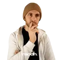 a man wearing a beanie and a white jacket with the word modh on the bottom