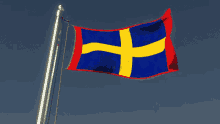 a blue and red flag with a yellow cross