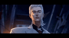 a man with glasses and a x on his shirt
