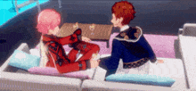 a couple of anime characters are sitting on a couch .