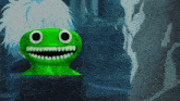 a green frog with big eyes and teeth is smiling in a dark room