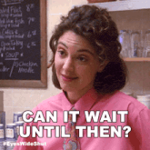 a woman in a pink shirt and tie is asking if she can wait until then