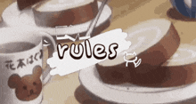 a coffee mug with a teddy bear on it sits next to a plate of food and a sign that says " rules "