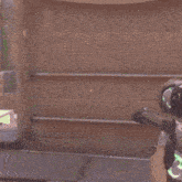 a person holding a sniper rifle with a green scope