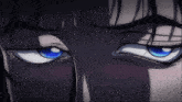 a close up of a person 's blue eyes with glasses
