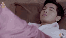 a man is sleeping in a bed with the number 7 on the bottom
