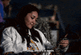 a woman is knitting and says okay there it is again ..