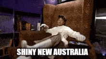 a person is laying on a couch with the words shiny new australia written on the bottom
