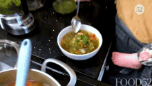 Adding Sauce Food52 GIF - Adding Sauce Food52 Stirring Soup GIFs