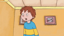 a cartoon boy in a blue and yellow striped shirt is standing in a room