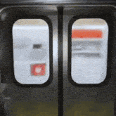 a close up of a refrigerator door with a bottle of water in the background
