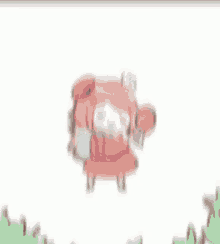 a blurry image of a person standing in the grass .