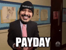 a man in a suit and tie with a beanie that says multivers on it