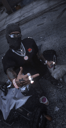 a man wearing a black shirt that says ' supreme ' on the front