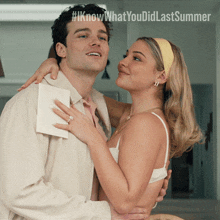 a man and a woman are hugging each other with #iknowwhatyou did last summer written on the bottom