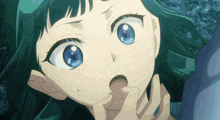 a close up of a girl with blue eyes