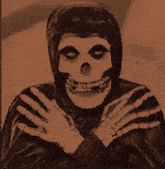 a picture of a skeleton holding a sign that says " happy "