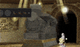 a video game screen shows a statue and a few buttons