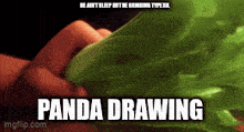 a person is holding a green object that says panda drawing on the bottom