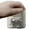 a close up of a person 's hand holding a toaster oven .