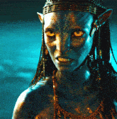 a close up of a woman 's face with blue skin