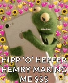 a kermit the frog is holding a cell phone with hearts and sunflowers around it .