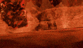 a video game character is surrounded by red flame
