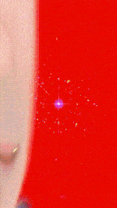 a close up of a person 's face with a star in the background