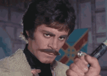 a man with a fake mustache is holding a green stick