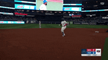 a baseball game is being played in a stadium with a budweiser advertisement