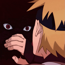a close up of a person covering their face with their hands