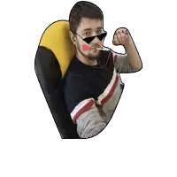 a man wearing sunglasses and a yellow pillow flexes his arm