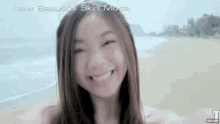 a woman taking a selfie on the beach with the words new beautiful skin mode written above her