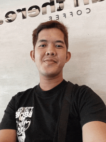a man wearing a black t-shirt that says " before " on it