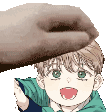 a hand is holding a child 's head .