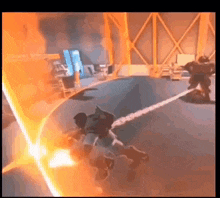 a video game is being played in a room with a lot of lights coming out of the ceiling .