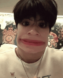 a person making a funny face with a clock behind them