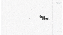 a poster for gray street shows a man kissing a woman