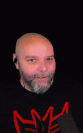 a man with a beard is covering his face in front of a sign that says " fuck wife "