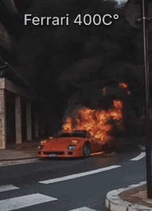 a red ferrari is on fire on the side of a road