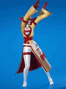 a woman in a red and yellow costume is dancing