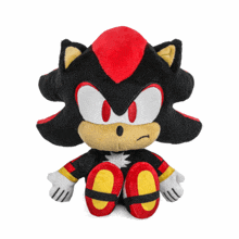 a stuffed shadow the hedgehog with a surprised look on his face sits on a white background