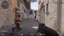 a screenshot of a video game shows a man running with a gun and a score of 100