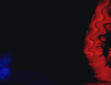 a blurry image of a person holding a sword