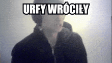 a blurred image of a person with the words urfy wrociey written above them