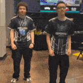 two guys wearing shirts that say esports on them