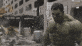 the hulk is standing in front of a building with a sign that says no smoking