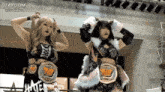 two female wrestlers are standing next to each other and the word stardom is on the bottom left