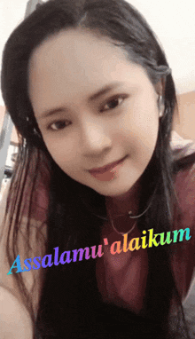 a woman 's face is shown with the words assalamu ' alaikum written on the bottom